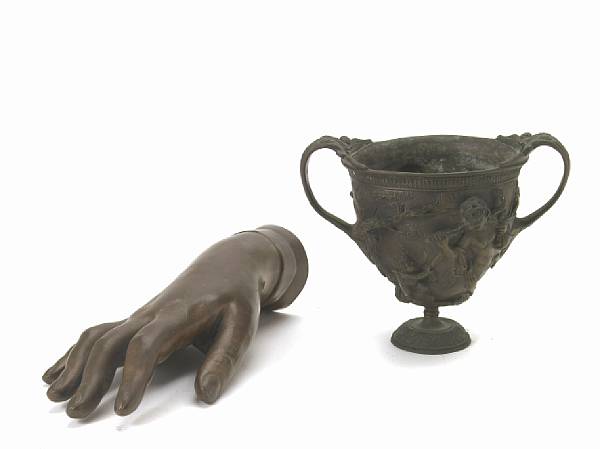 Appraisal: A patinated bronze study of a hand cast after a