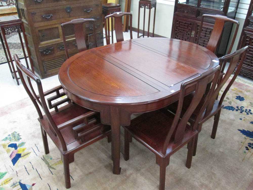 Appraisal: ROSEWOOD DINING TABLE AND CHAIR SET Chinese export late th