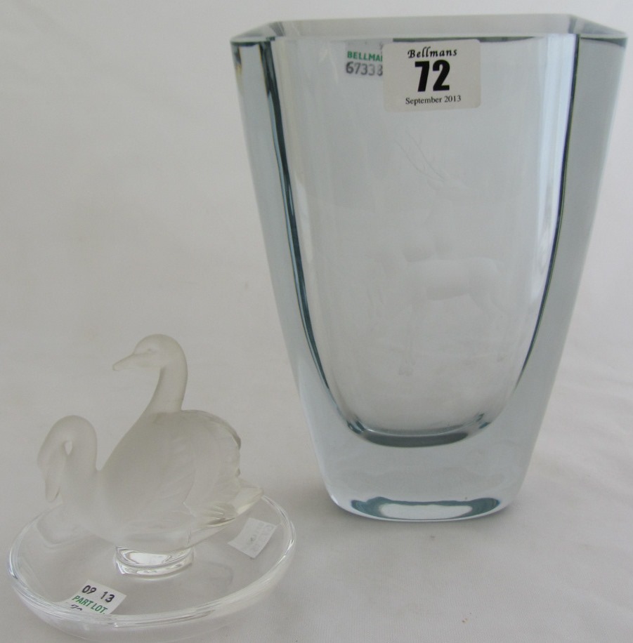 Appraisal: A Lalique clear and frosted glass Cendrier moulded with swans