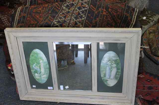 Appraisal: A WALL MIRROR with central bevelled glass flanked by oval