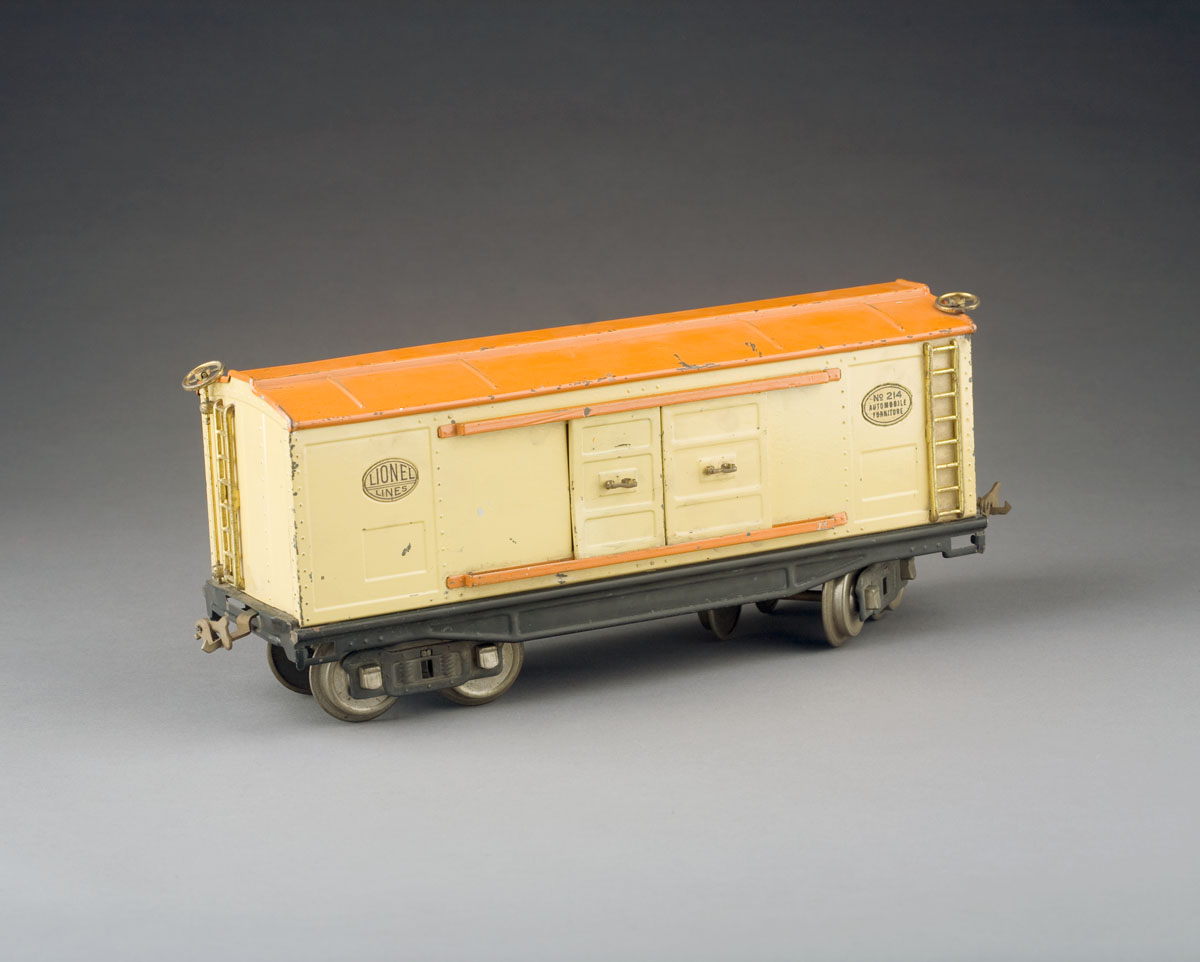 Appraisal: LIONEL BOX CAR IN CREAM PAINT WITH PLAQUE quot AUTOMOBILE