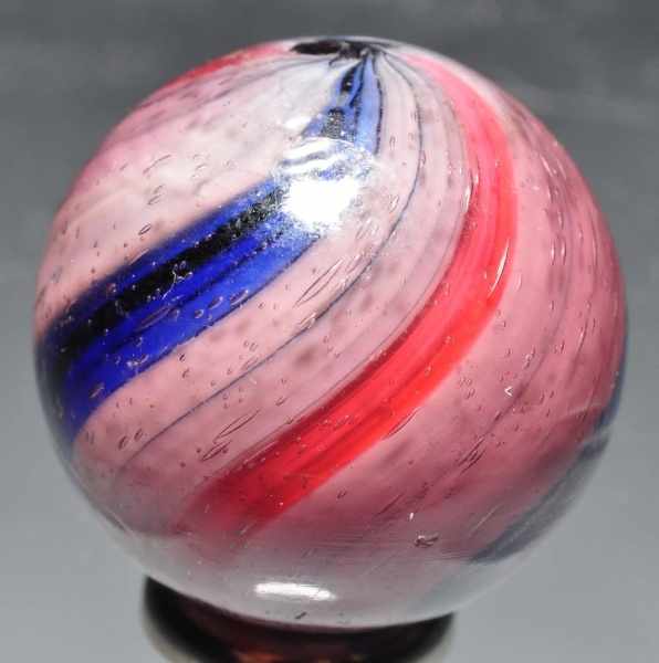 Appraisal: Peppermint Swirl Marble in Amethyst Glass Description Outer casing of