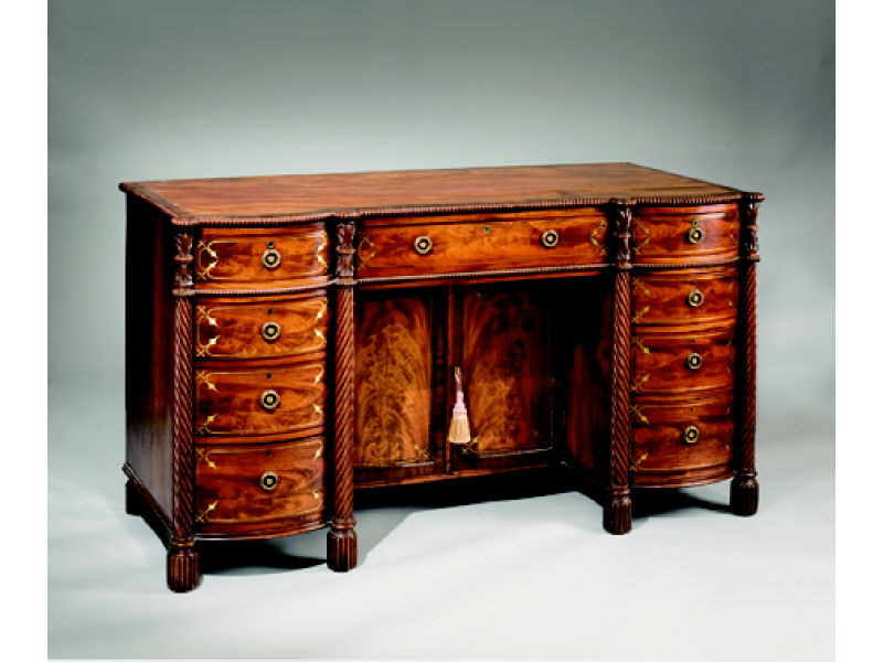 Appraisal: ENGLISH REGENCY MAHOGANY AND BRASS INLAID DESK The shaped and