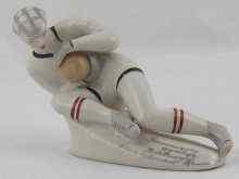 Appraisal: A Ukrainian Soviet ceramic model of a footballer fielding a