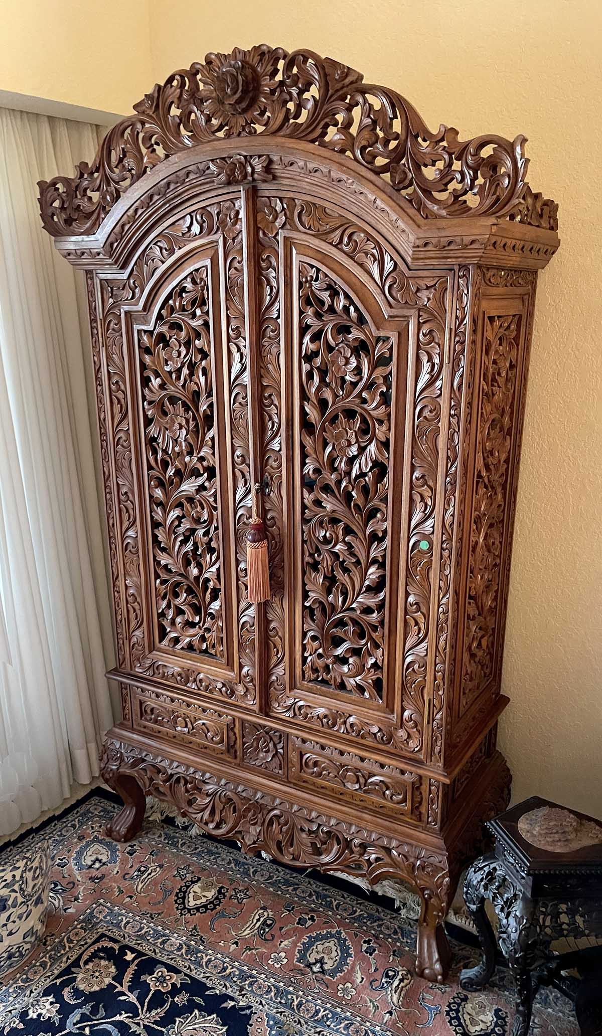 Appraisal: RICHLY CARVED DOOR ARMOIRE Two door over two door Armoire