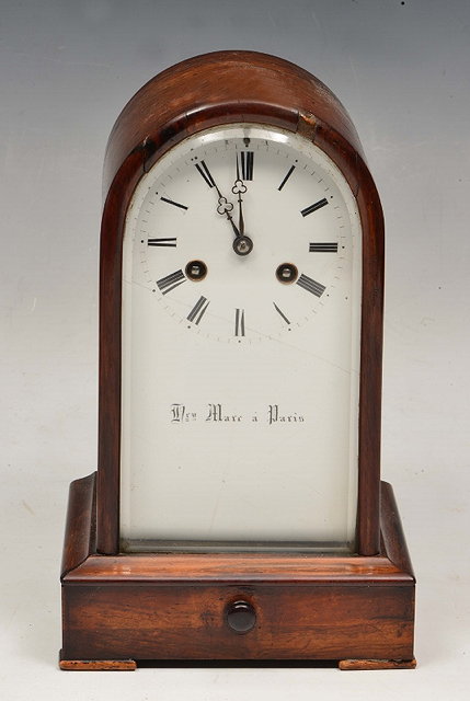 Appraisal: A ROSEWOOD MANTEL CLOCK by Henry Marc Paris with white