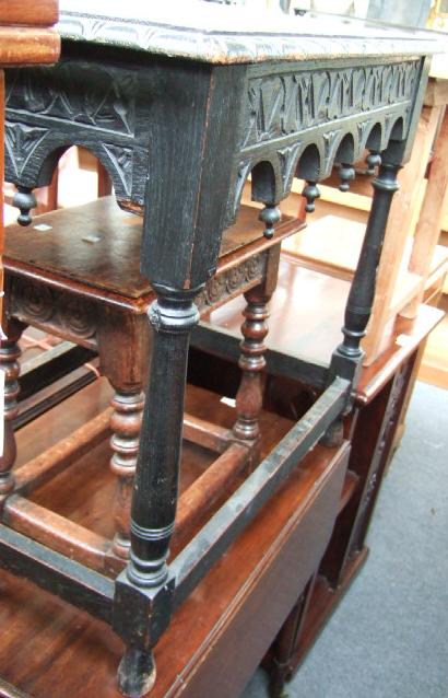 Appraisal: A Victorian ebonised oak occasional table with shaped frieze and