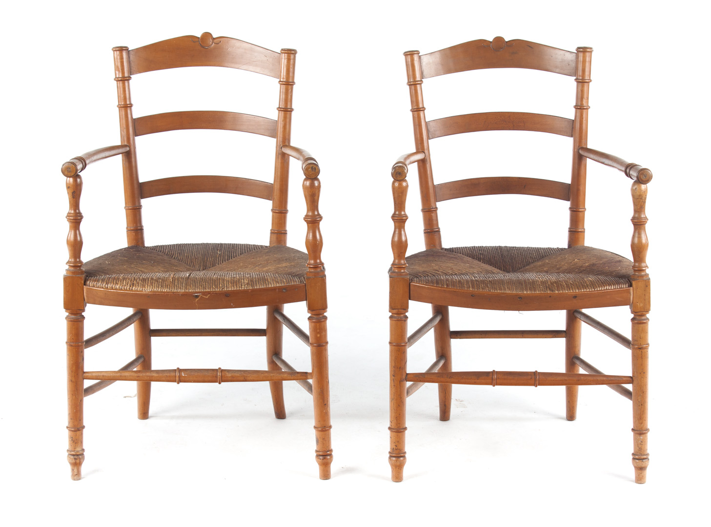 Appraisal: Pair of French Provincial fruitwood armchairs late th century ladder-backs