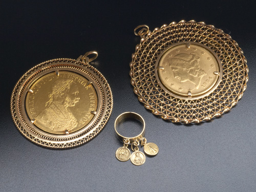 Appraisal: Pendant mounted coins and an k yg saints charm ring