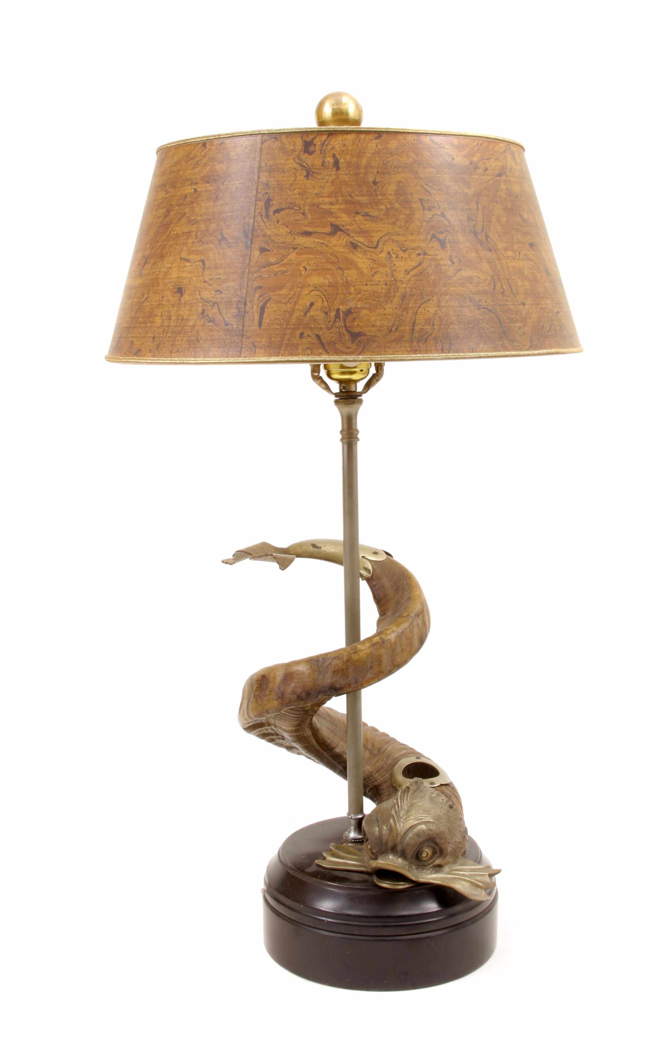 Appraisal: A whimsical gilt bronze and horn dolphin form table lamp