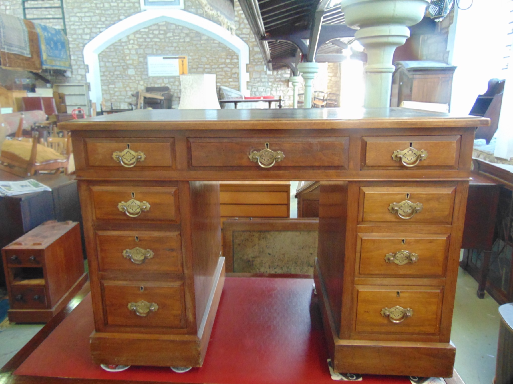 Appraisal: A small late Victorian walnut kneehole twin pedestal writing desk