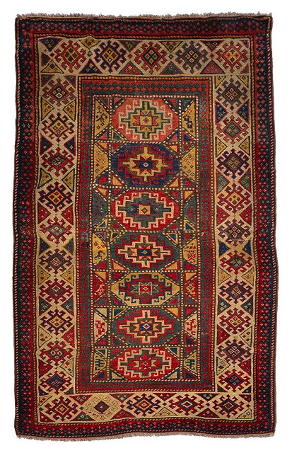 Appraisal: A KASAK MULTI-COLOURED RUG the central panel with seven interlinking