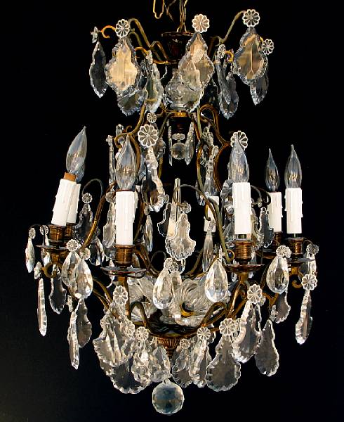 Appraisal: A gilt metal and cut glass chandelier hung with facet