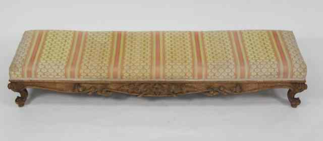 Appraisal: A carved framed footstool with carved frieze on cabriole legs