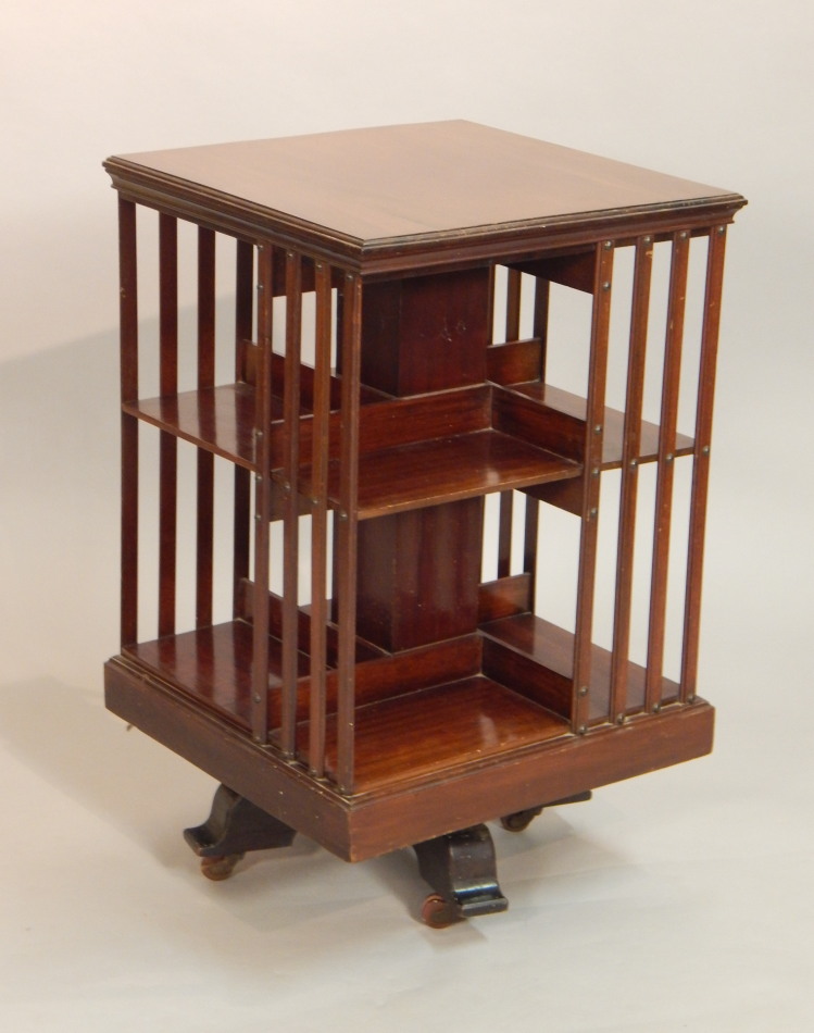 Appraisal: An Edwardian mahogany revolving bookcase the square top with a