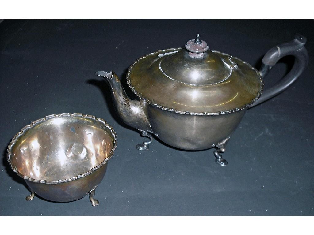 Appraisal: Two part bullet shaped tea service with wavy borders on