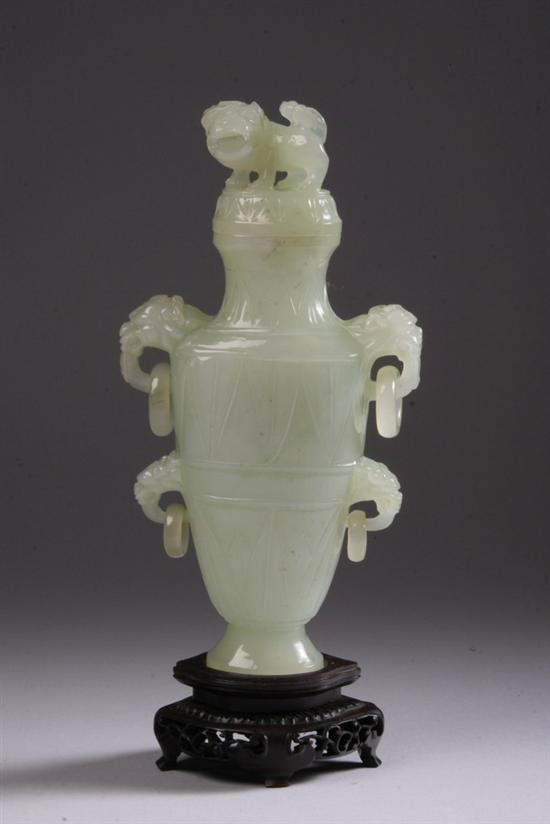 Appraisal: CHINESE CELADON JADE VASE AND COVER Flattened ovoid-form flanked by