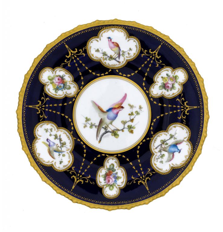 Appraisal: A ROYAL CROWN DERBY COBALT GROUND PLATE unusually painted by