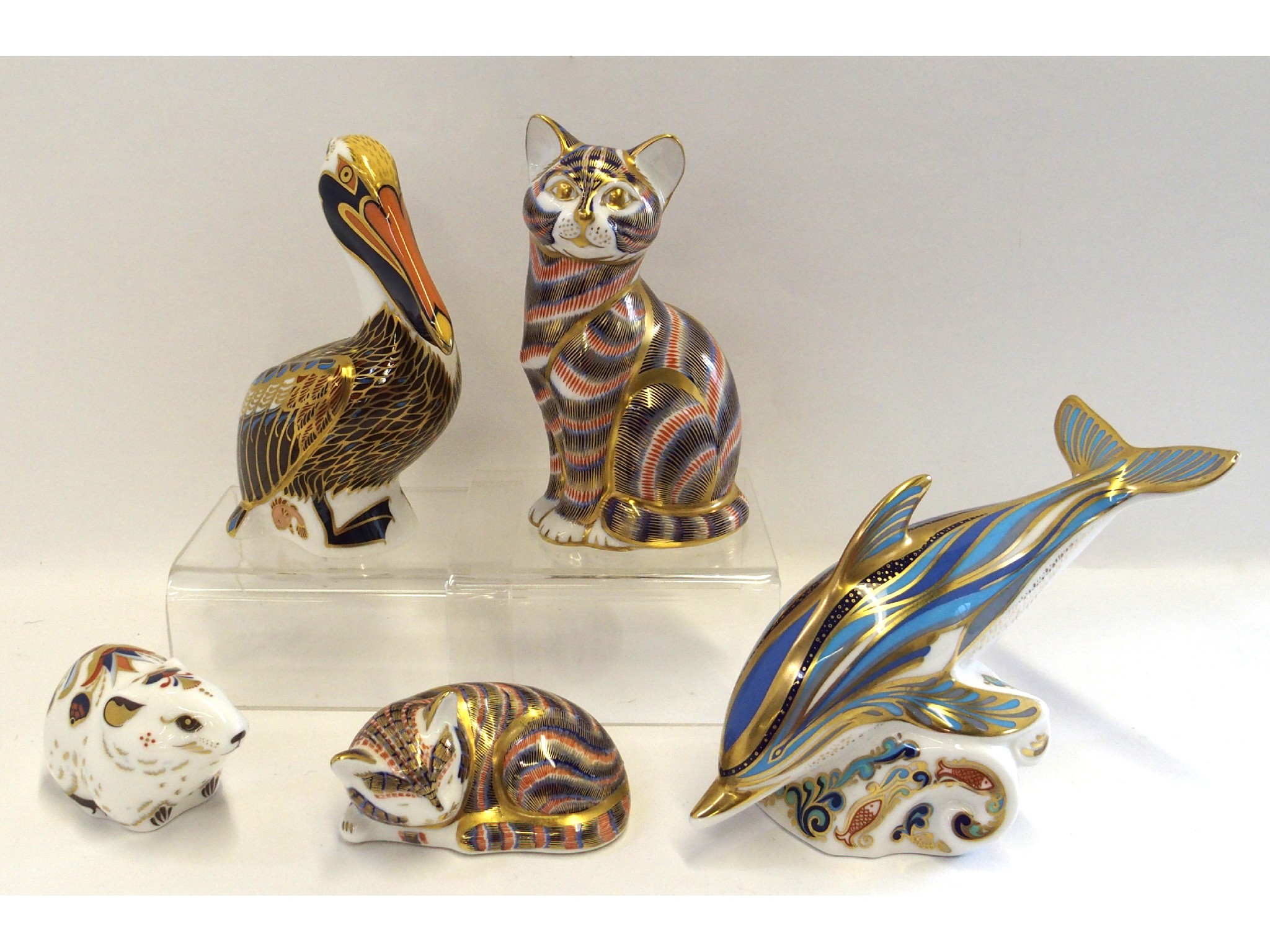 Appraisal: Five Royal Crown Derby paperweights including Pelican Dolphin Bank Vole