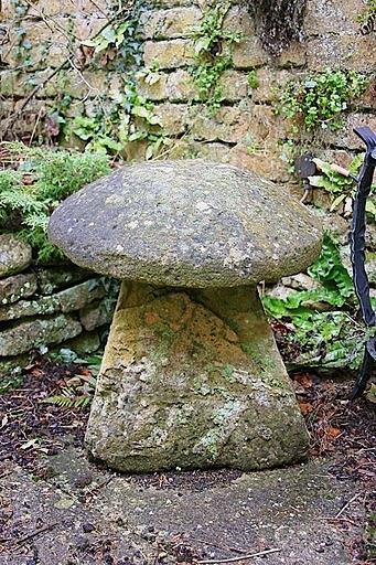 Appraisal: A staddle stone with irregular circular top and a squat