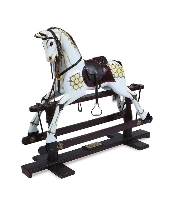 Appraisal: A MODERN PAINTED ROCKING HORSE with leather saddle and dapple