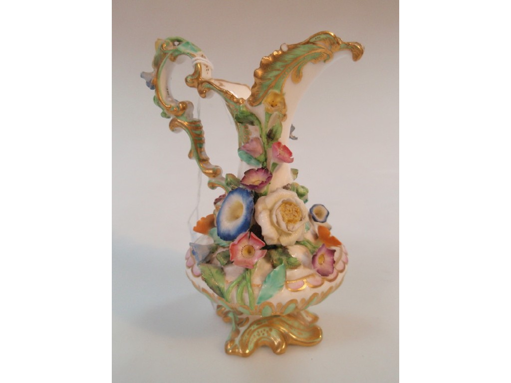 Appraisal: An early thC Rockingham porcelain ewer with floral encrusted decoration