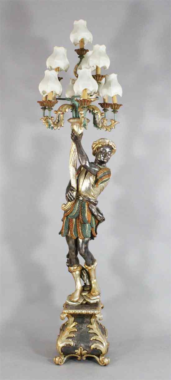 Appraisal: A carved silvered and painted wood blackamoor figural ten light