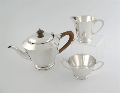 Appraisal: A matched modern three-piece teaset with tapering plain bodies and