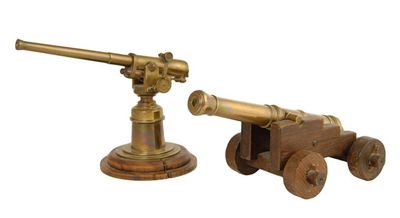 Appraisal: A brass model cannon in cm l on an oak