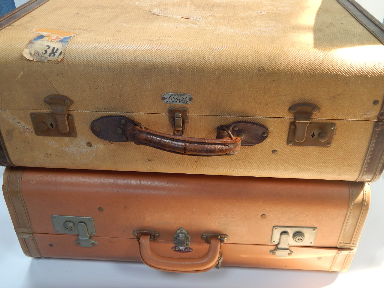 Appraisal: Two mid thC suitcases comprising of a tweed and leather