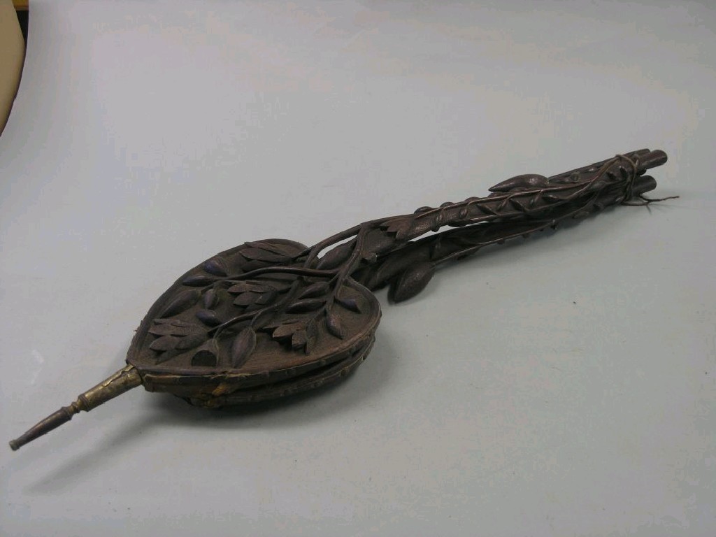 Appraisal: A pair of carved wood long-arm bellows the arms carved