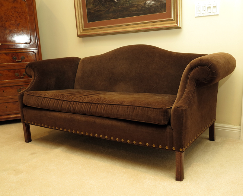 Appraisal: CHIPPENDALE STYLE CAMELBACK SETTEE Classic camel back and scroll arms