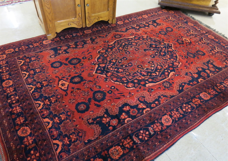 Appraisal: AN AFGHANI BELOUCH CARPET hand knotted in a floral and