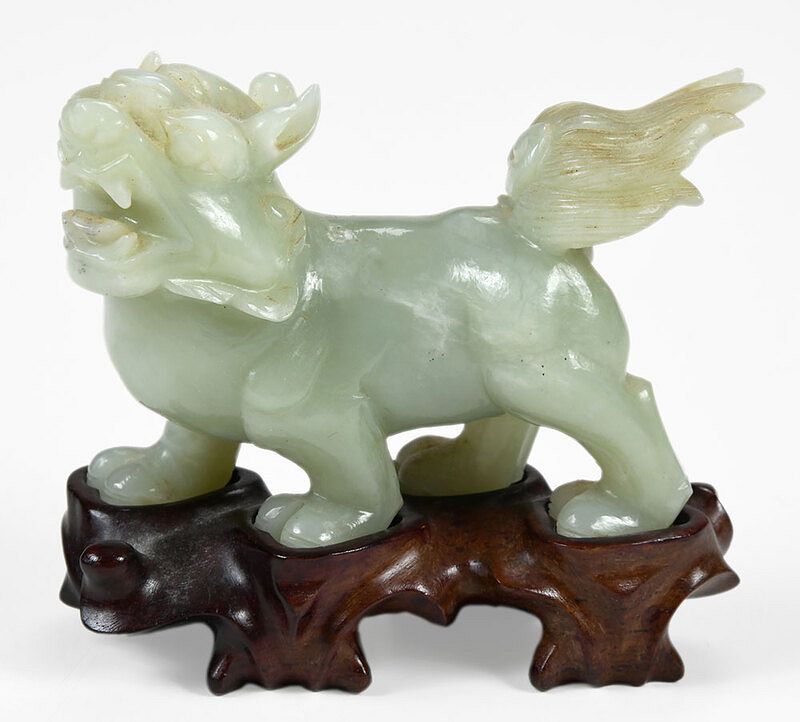 Appraisal: Chinese Carved Hardstone Foo Dog on Stand th century pale