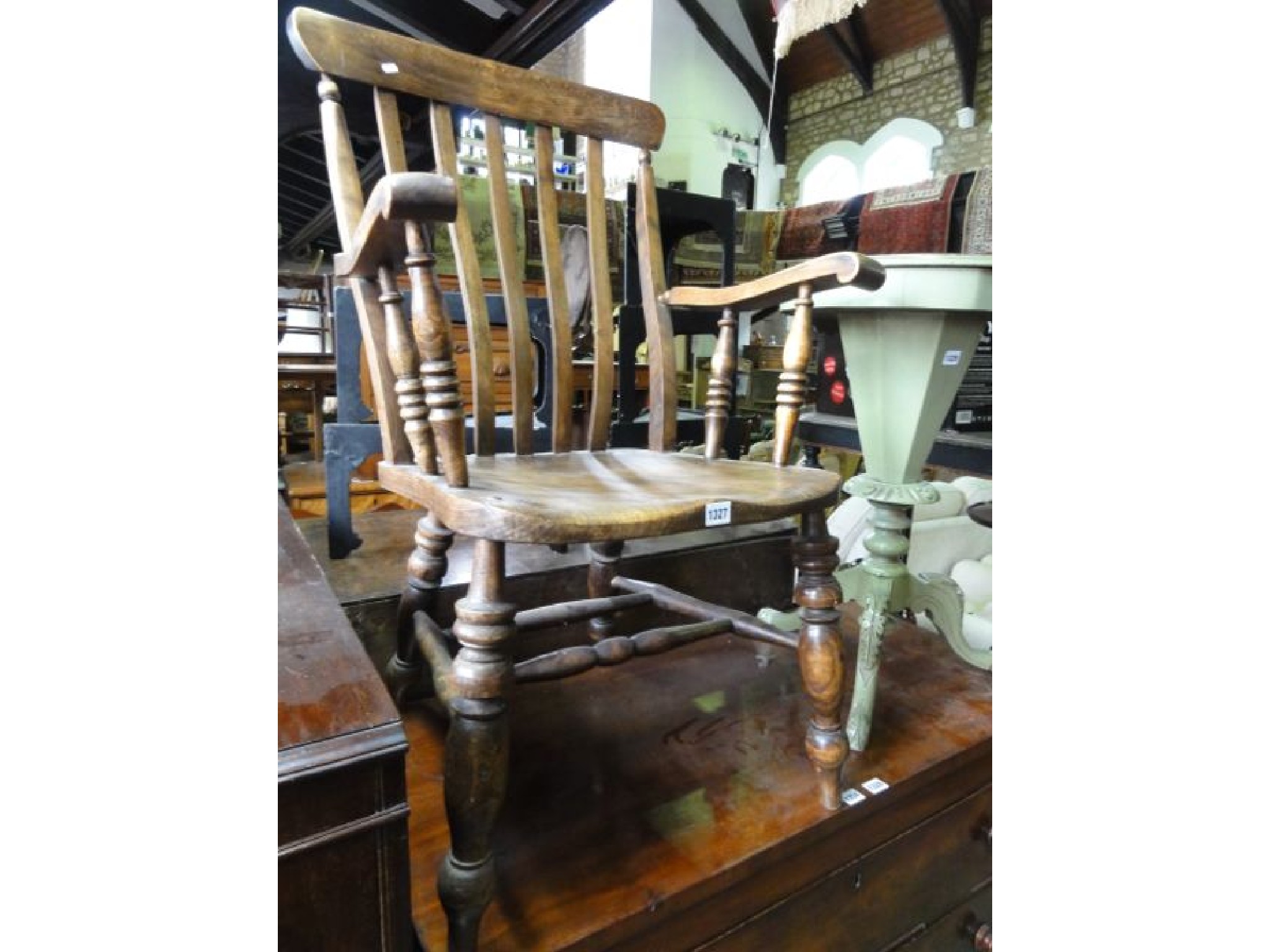 Appraisal: A Victorian Windsor elm and beechwood lathe back kitchen armchair