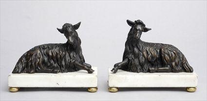 Appraisal: PAIR OF LOUIS XVI-STYLE BRONZE FIGURES OF RAMS ON MARBLE