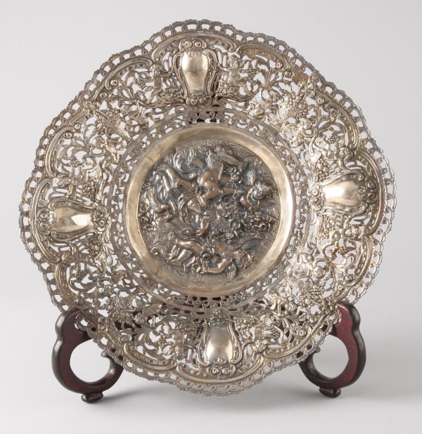 Appraisal: silver bowl with reticulated border and footed base putti in