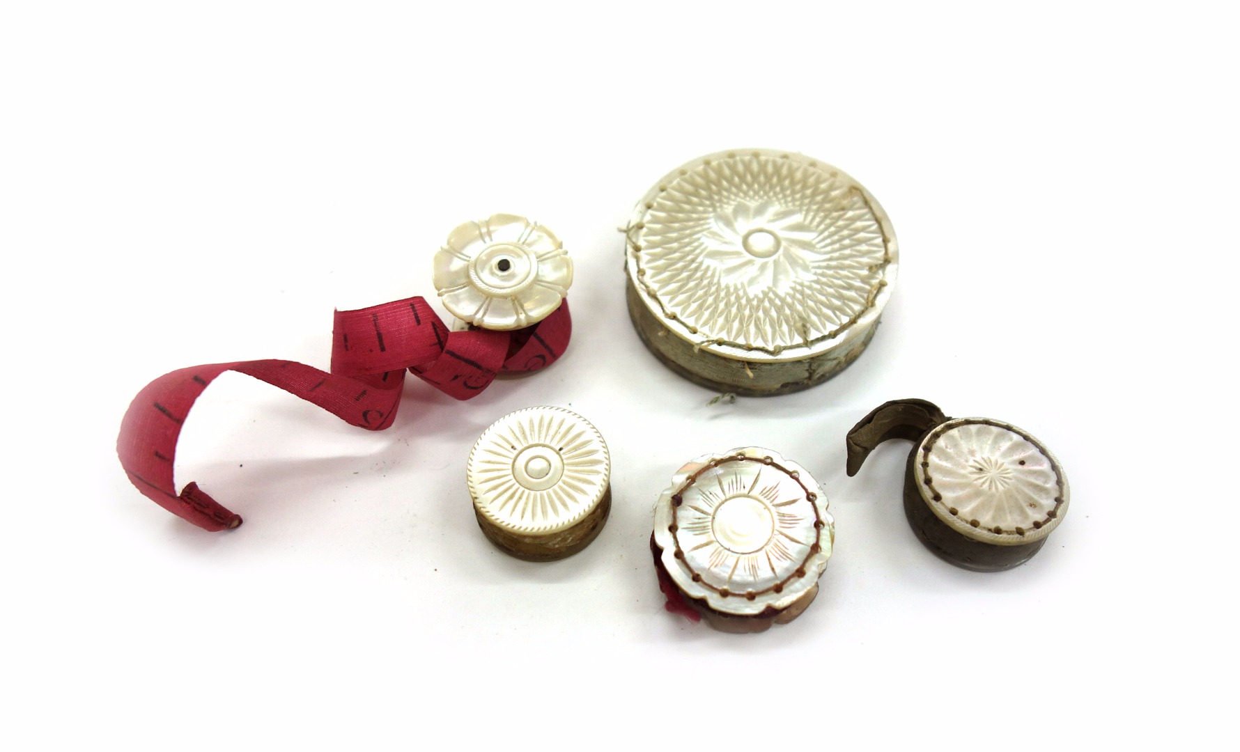 Appraisal: A collection of four carved mother of pearl waxers th