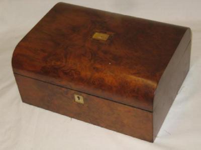 Appraisal: A VICTORIAN WALNUT SEWING BOX of oblong form the mildly