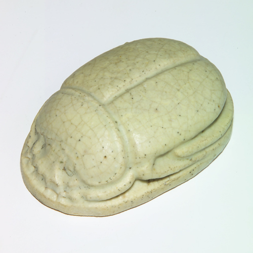 Appraisal: GRUEBY Scarab-shaped paperweight covered in matte ivory glaze A couple