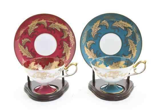 Appraisal: A Near Pair of Continental Porcelain Cups and Saucers having