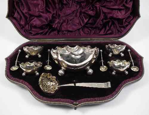 Appraisal: A Victorian silver table service with crimped rims comprising -