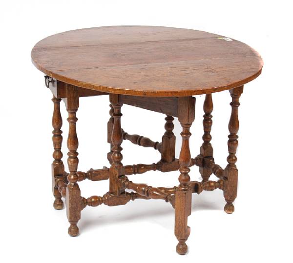 Appraisal: A William and Mary style oak gate leg table height