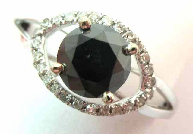 Appraisal: BLACK DIAMOND AND WHITE GOLD RING k white gold centering