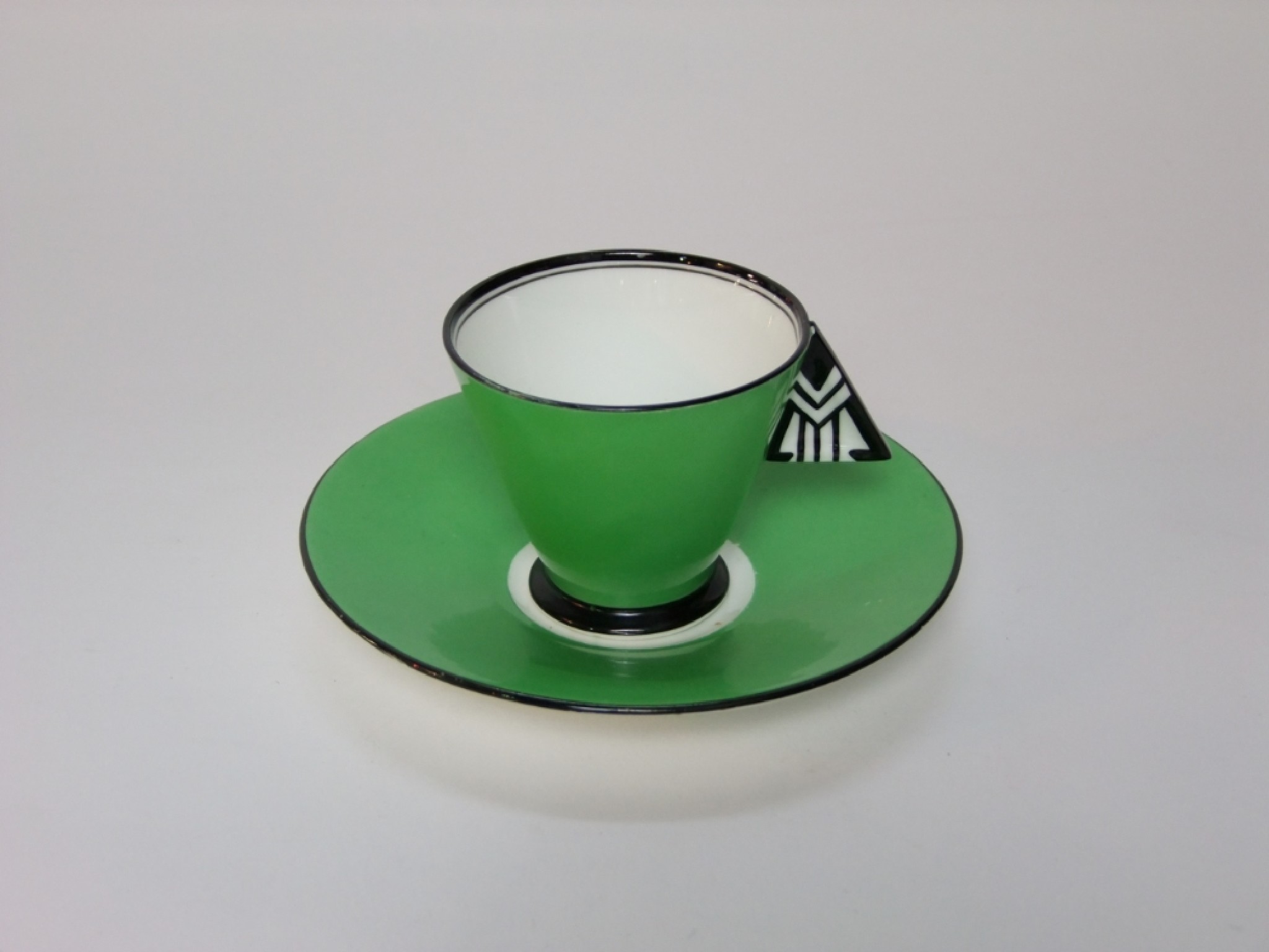 Appraisal: A Shelley Vogue green ground cup and saucer in the