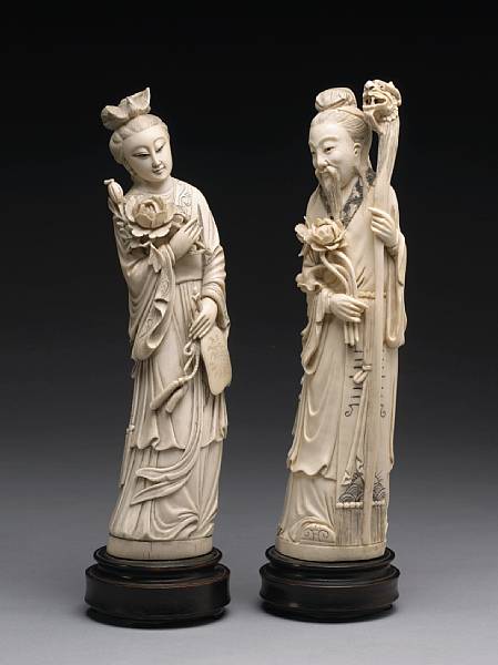 Appraisal: Two ivory figural carvings th Century Each standing with a