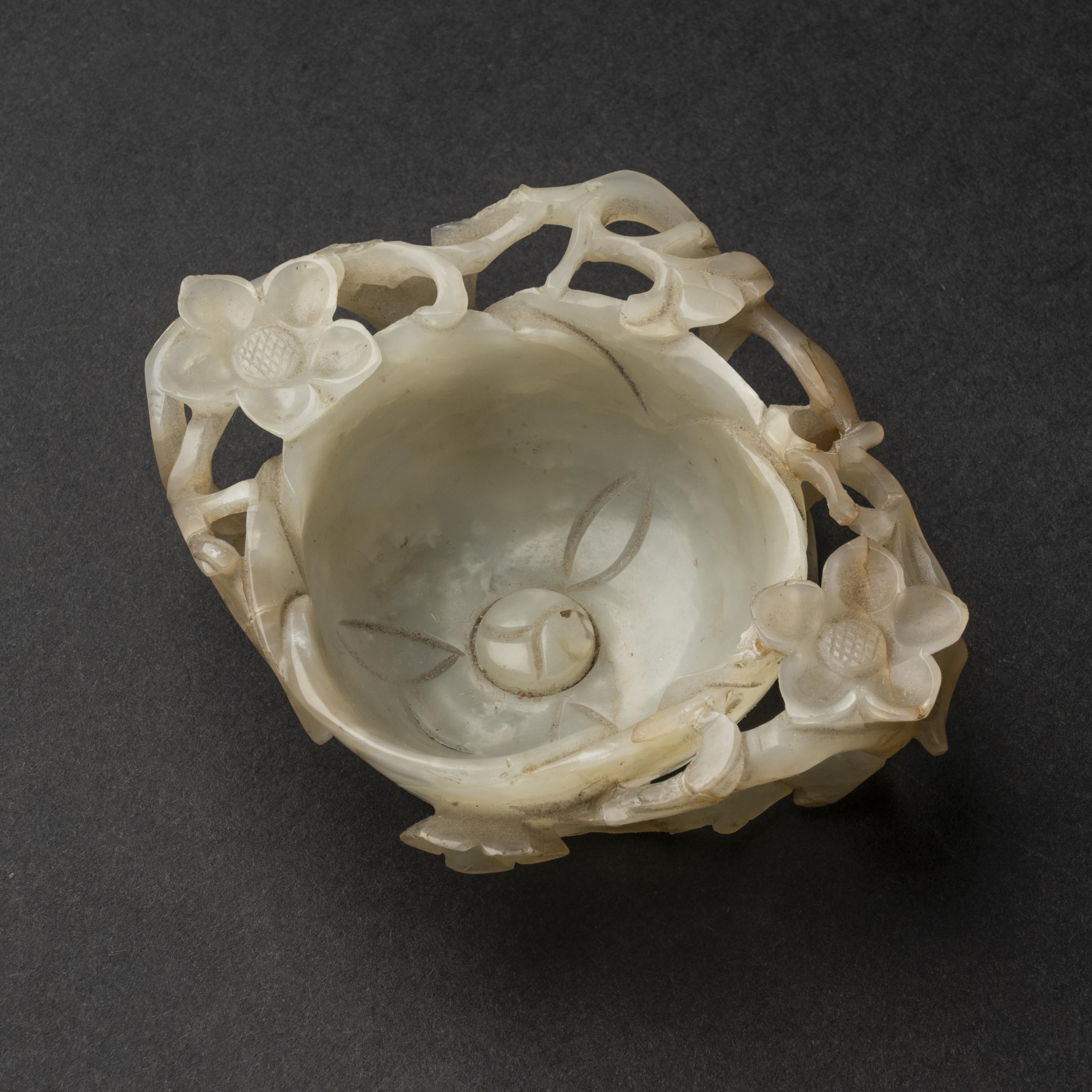 Appraisal: A White Jade Lotus-Form Cup Ming Dynasty - Well-carved to