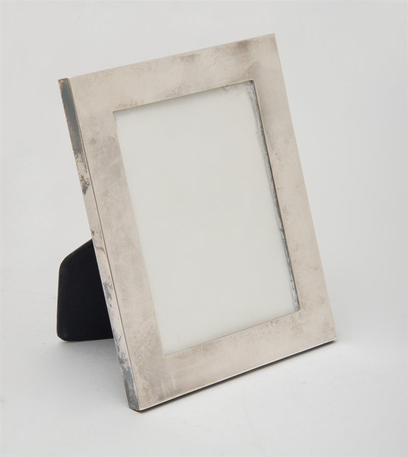 Appraisal: HERMES SILVER-PLATED PICTURE FRAME With leather-back easel support impressed 'Hermes