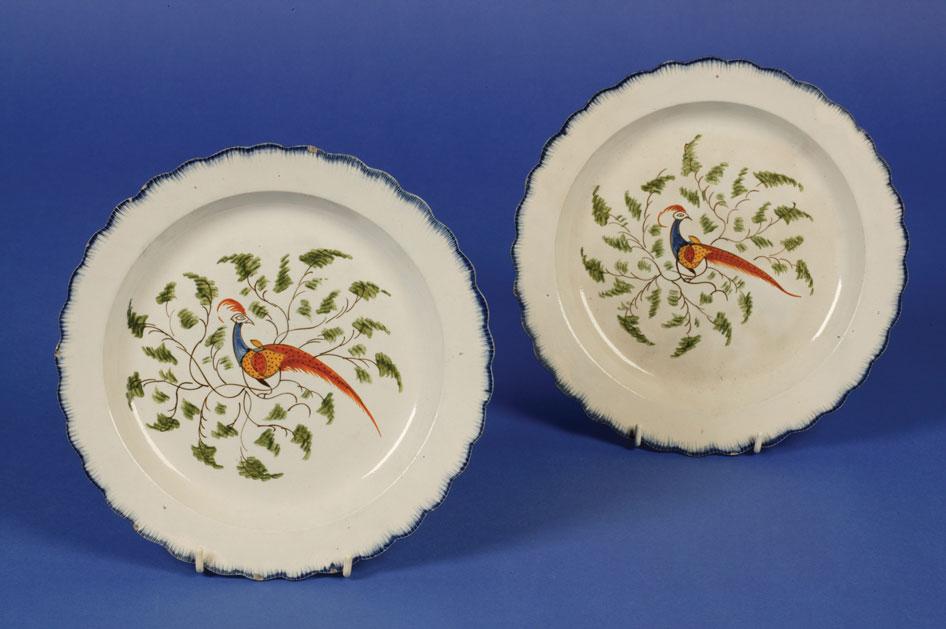 Appraisal: A PAIR OF LIVERPOOL CREAMWARE POLYCHROME PLATES circa the central