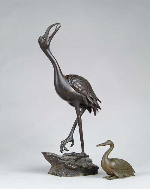 Appraisal: TWO BRONZE BIRDS One a standing stork with upraised head